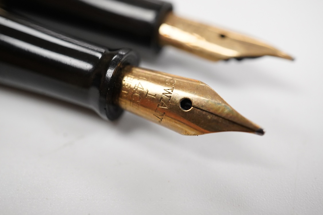 A Swan MT & Co. sterling silver filigree eyedropper along with similar gold filled example